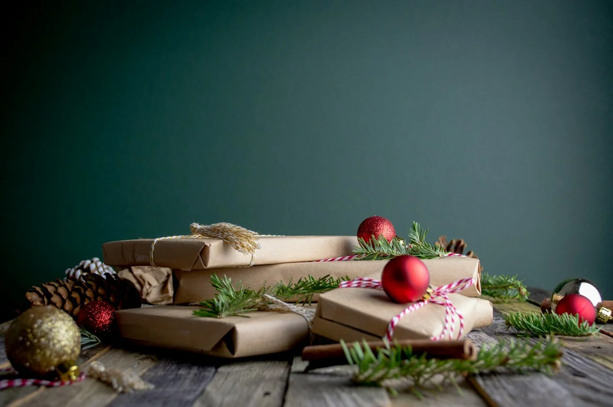 Elegant Christmas gift presentation with red ornaments